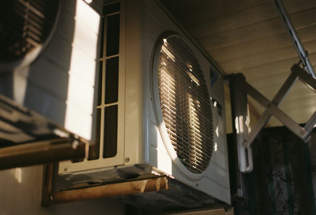 Close-up of an air conditioning unit on a sunny day.